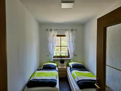 Ein Bett oder Betten in einem Zimmer der Unterkunft Angeln am Regen - Angelhof Posl