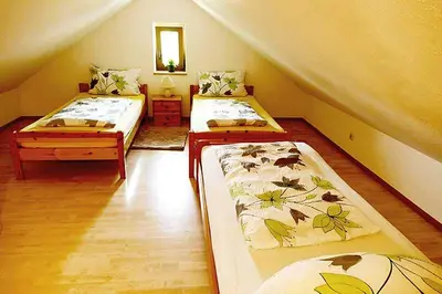 Ein Bett oder Betten in einem Zimmer der Unterkunft Angeln am Regen - Angelhof Posl