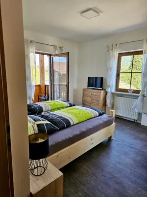 Ein Bett oder Betten in einem Zimmer der Unterkunft Angeln am Regen - Angelhof Posl