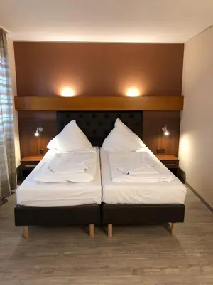 Ein Bett oder Betten in einem Zimmer der Unterkunft Hotel Poseidon