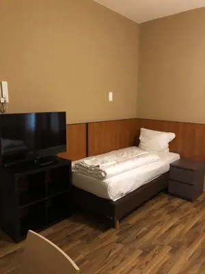 Ein Bett oder Betten in einem Zimmer der Unterkunft Hotel Poseidon