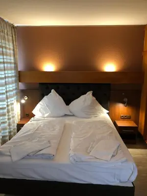 Ein Bett oder Betten in einem Zimmer der Unterkunft Hotel Poseidon