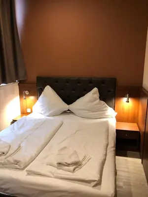 Ein Bett oder Betten in einem Zimmer der Unterkunft Hotel Poseidon