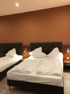 Ein Bett oder Betten in einem Zimmer der Unterkunft Hotel Poseidon