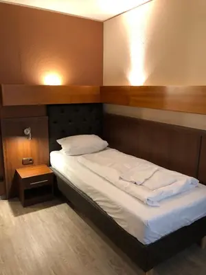 Ein Bett oder Betten in einem Zimmer der Unterkunft Hotel Poseidon