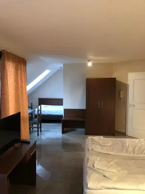 Ein Bett oder Betten in einem Zimmer der Unterkunft Hotel Poseidon