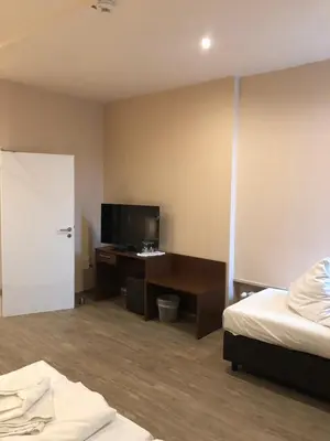 Ein Bett oder Betten in einem Zimmer der Unterkunft Hotel Poseidon