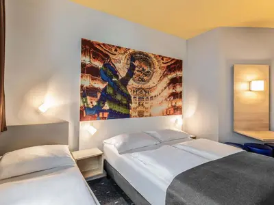 Ein Bett oder Betten in einem Zimmer der Unterkunft B&B Hotel Bayreuth