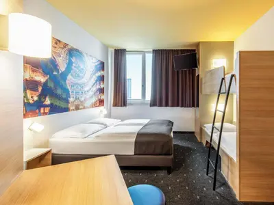 Ein Bett oder Betten in einem Zimmer der Unterkunft B&B Hotel Bayreuth