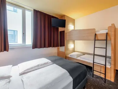 Ein Bett oder Betten in einem Zimmer der Unterkunft B&B Hotel Bayreuth