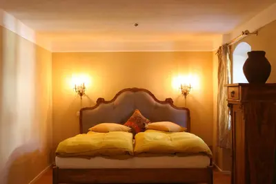 Ein Bett oder Betten in einem Zimmer der Unterkunft Bräustüberl Schönbrunn - Hotel & Restaurant