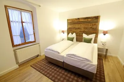Ein Bett oder Betten in einem Zimmer der Unterkunft Aparthotel Deutscher Kaiser Ferienwohnungen