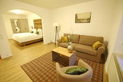 Ein Bett oder Betten in einem Zimmer der Unterkunft Aparthotel Deutscher Kaiser Ferienwohnungen