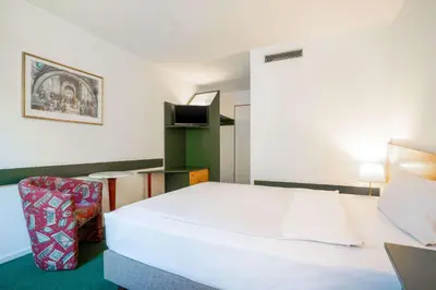 Ein Bett oder Betten in einem Zimmer der Unterkunft Quality Hotel Hof