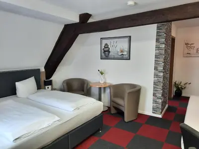 Ein Bett oder Betten in einem Zimmer der Unterkunft Hotel Luca
