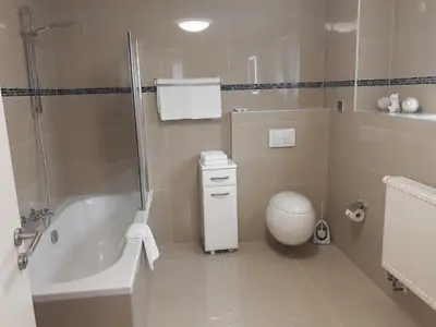 Ein Badezimmer in der Unterkunft Hotel Luca