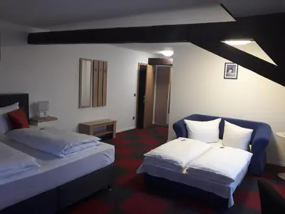 Ein Bett oder Betten in einem Zimmer der Unterkunft Hotel Luca