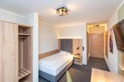 Ein Bett oder Betten in einem Zimmer der Unterkunft Hotel Schwan