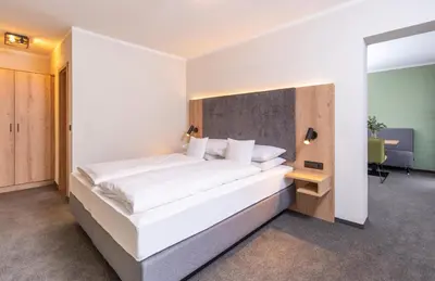 Ein Bett oder Betten in einem Zimmer der Unterkunft Hotel Schwan