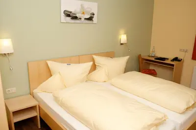 Ein Bett oder Betten in einem Zimmer der Unterkunft Hotel Gasthof zur Post
