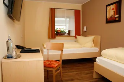 Ein Bett oder Betten in einem Zimmer der Unterkunft Hotel Gasthof zur Post