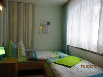 Ein Bett oder Betten in einem Zimmer der Unterkunft Ferienwohnung 