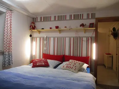 Ein Bett oder Betten in einem Zimmer der Unterkunft Ferienwohnung 