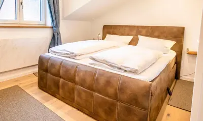 Ein Bett oder Betten in einem Zimmer der Unterkunft Ferienwohnung Biobauernhof Peter Anderl Hof