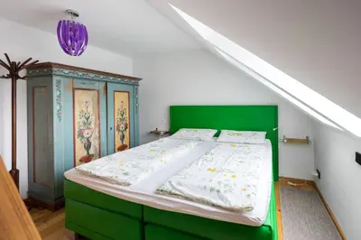 Ein Bett oder Betten in einem Zimmer der Unterkunft Ferienwohnung Biobauernhof Peter Anderl Hof
