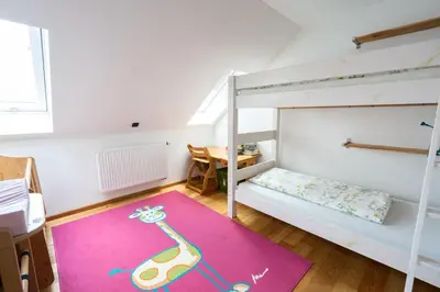 Ein Bett oder Betten in einem Zimmer der Unterkunft Ferienwohnung Biobauernhof Peter Anderl Hof
