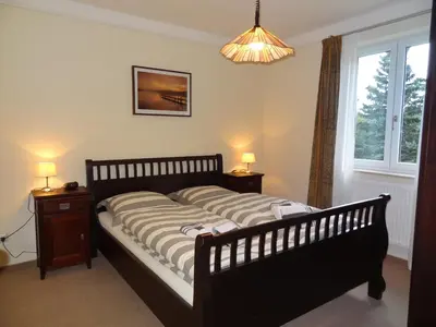 Ein Bett oder Betten in einem Zimmer der Unterkunft Appartements im Hollandhaus