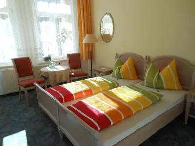 Ein Bett oder Betten in einem Zimmer der Unterkunft Pension Fürstenhof