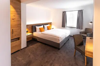 Ein Bett oder Betten in einem Zimmer der Unterkunft Hotel Tannenhaus