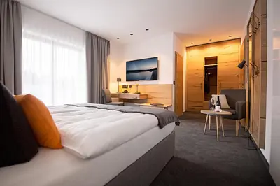 Ein Bett oder Betten in einem Zimmer der Unterkunft Hotel Tannenhaus