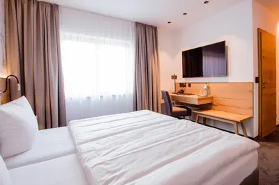 Ein Bett oder Betten in einem Zimmer der Unterkunft Hotel Tannenhaus
