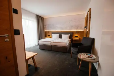 Ein Bett oder Betten in einem Zimmer der Unterkunft Hotel Tannenhaus