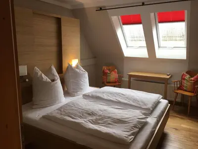 Ein Bett oder Betten in einem Zimmer der Unterkunft Landgasthof Haueis
