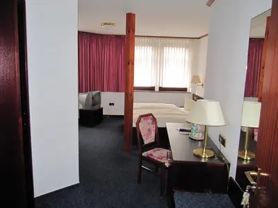 Ein Bett oder Betten in einem Zimmer der Unterkunft Hotel Wettin