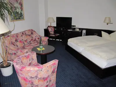 Ein Bett oder Betten in einem Zimmer der Unterkunft Hotel Wettin