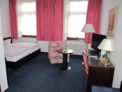 Ein Bett oder Betten in einem Zimmer der Unterkunft Hotel Wettin