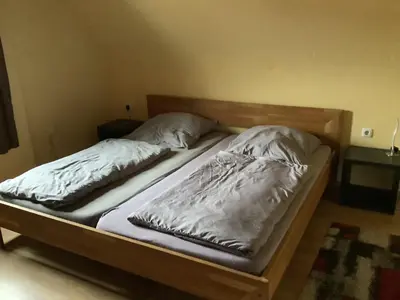 Ein Bett oder Betten in einem Zimmer der Unterkunft Ferienwohnung Eva und Alexander