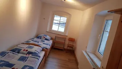 Ein Bett oder Betten in einem Zimmer der Unterkunft Ferienwohnung Trogschneider Hof
