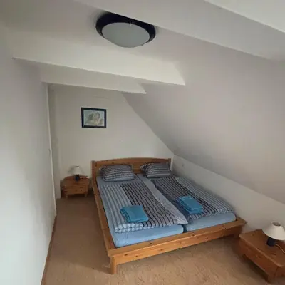 Ein Bett oder Betten in einem Zimmer der Unterkunft FeWo Stütz-Punkt Oberwiesenthal