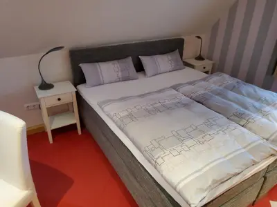 Ein Bett oder Betten in einem Zimmer der Unterkunft B & B Gästehaus Schmidt
