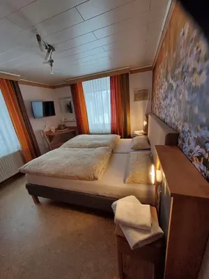 Ein Bett oder Betten in einem Zimmer der Unterkunft B & B Gästehaus Schmidt