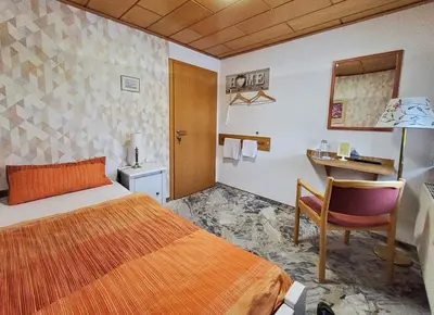 Ein Bett oder Betten in einem Zimmer der Unterkunft B & B Gästehaus Schmidt