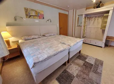 Ein Bett oder Betten in einem Zimmer der Unterkunft B & B Gästehaus Schmidt