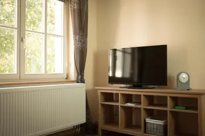 TV/Unterhaltungsangebot in der Unterkunft moments café & apartmenthaus