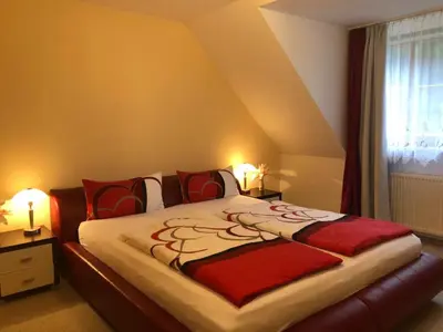 Ein Bett oder Betten in einem Zimmer der Unterkunft Ferienwohnung/ Ferienresidenze Manuela