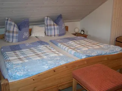 Ein Bett oder Betten in einem Zimmer der Unterkunft Pension Frauenschuh